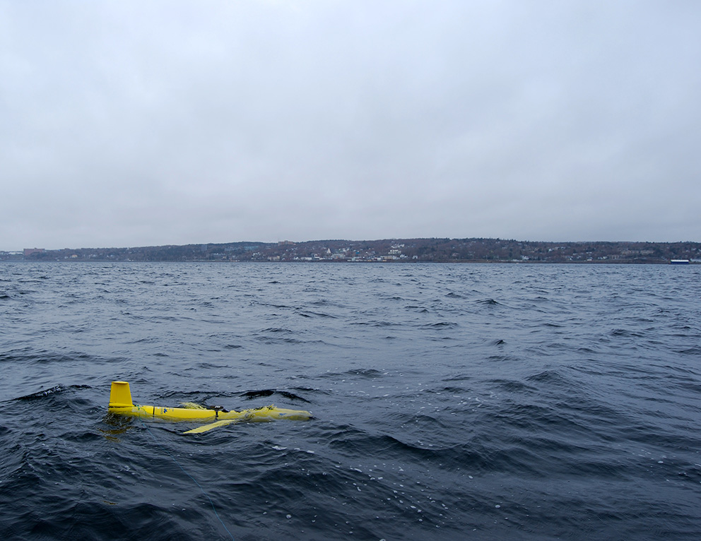 An tracking glider floating on the surface of the ocean.