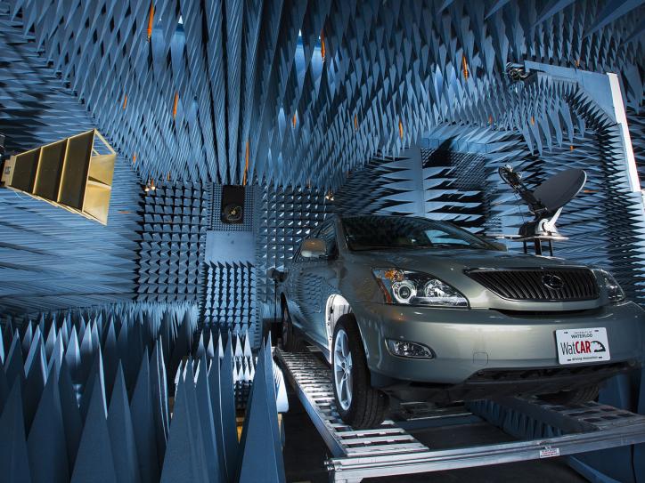 A car parked on a platform inside a chamber with walls covered in foam cones
