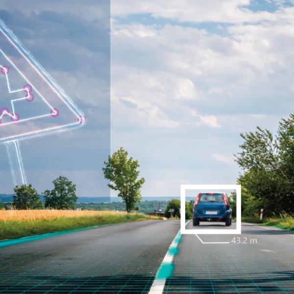 A two-lane highway viewed from a windshield with a car ahead and several digital markers overlain on the image