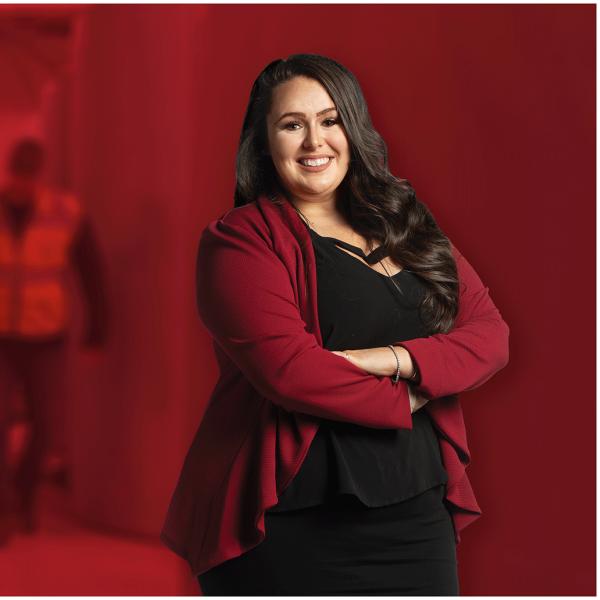 Teaghan Wellman poses in front of a blurred background