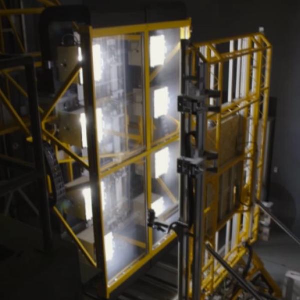 Floor to ceiling solar panels simulate a sunny day in a concrete research facility.