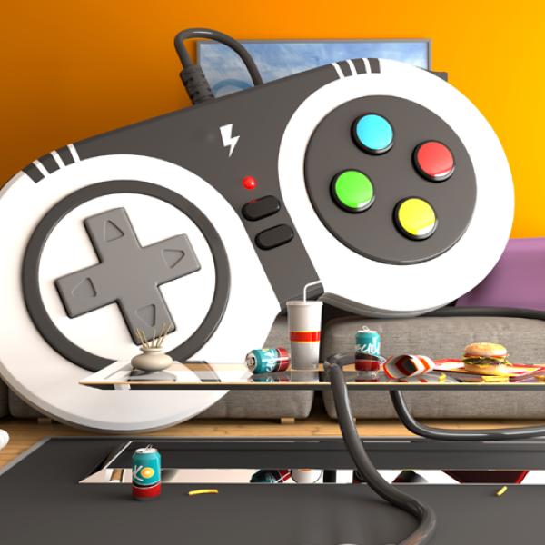 An oversized video game controller appears to lounge on a couch looking toward a coffee table with drinks and snacks