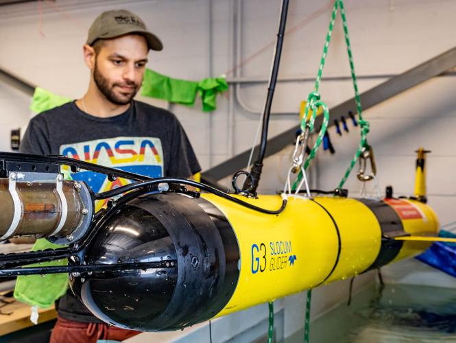 An OTN glider technician testing a Slocum glider at the Centre for Ocean Ventures and Entrepreneurship (COVE) in Dartmouth, Nova Scotia. (Photo source: Nicolas Winkler Photography)