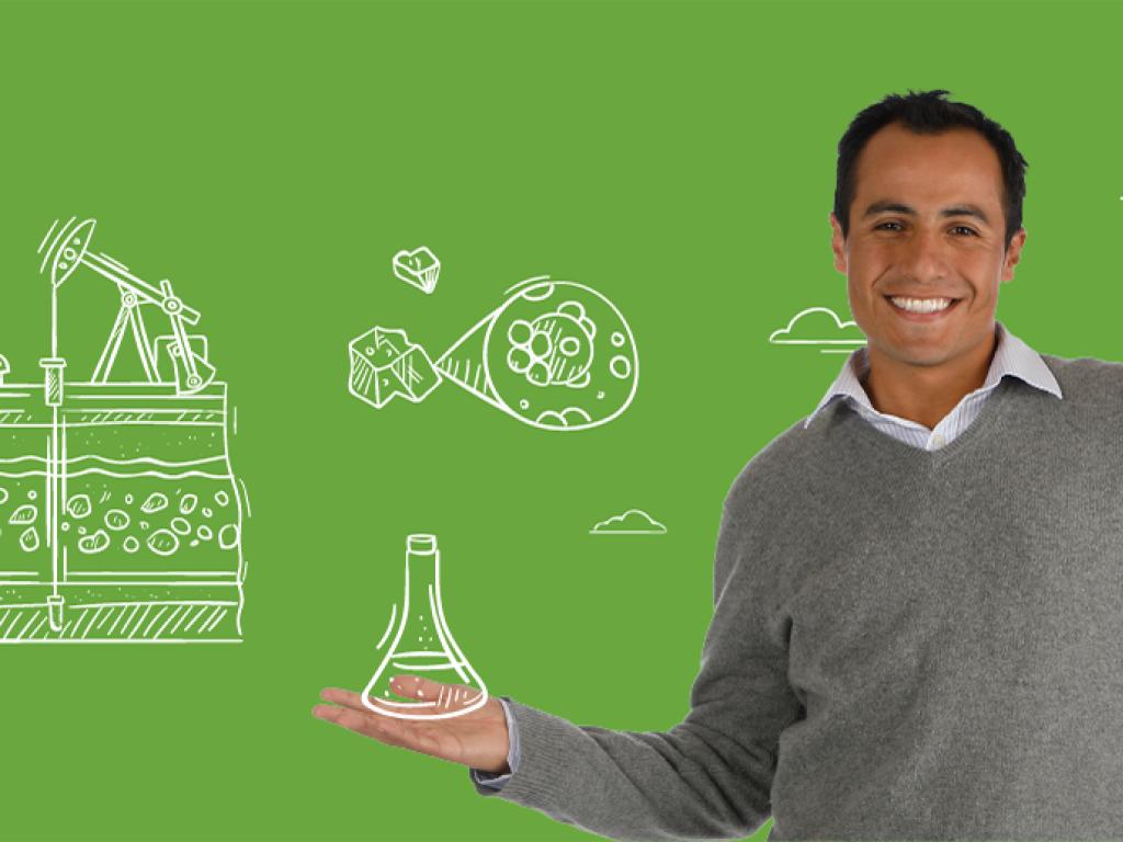 Research associate Luis Alejandro Coy posing for a photo over a green background.