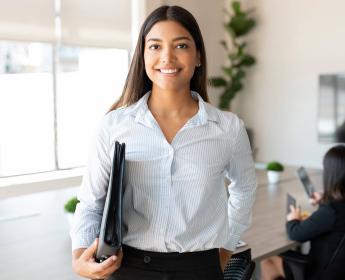 An employee standing in a conference room