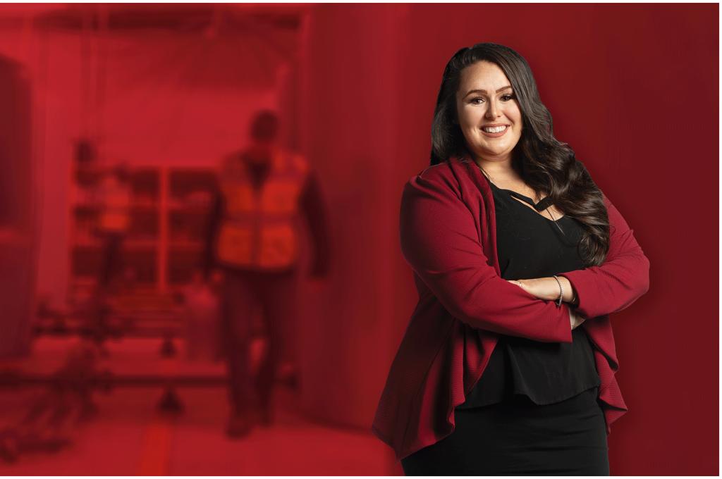 Teaghan Wellman poses in front of a blurred background