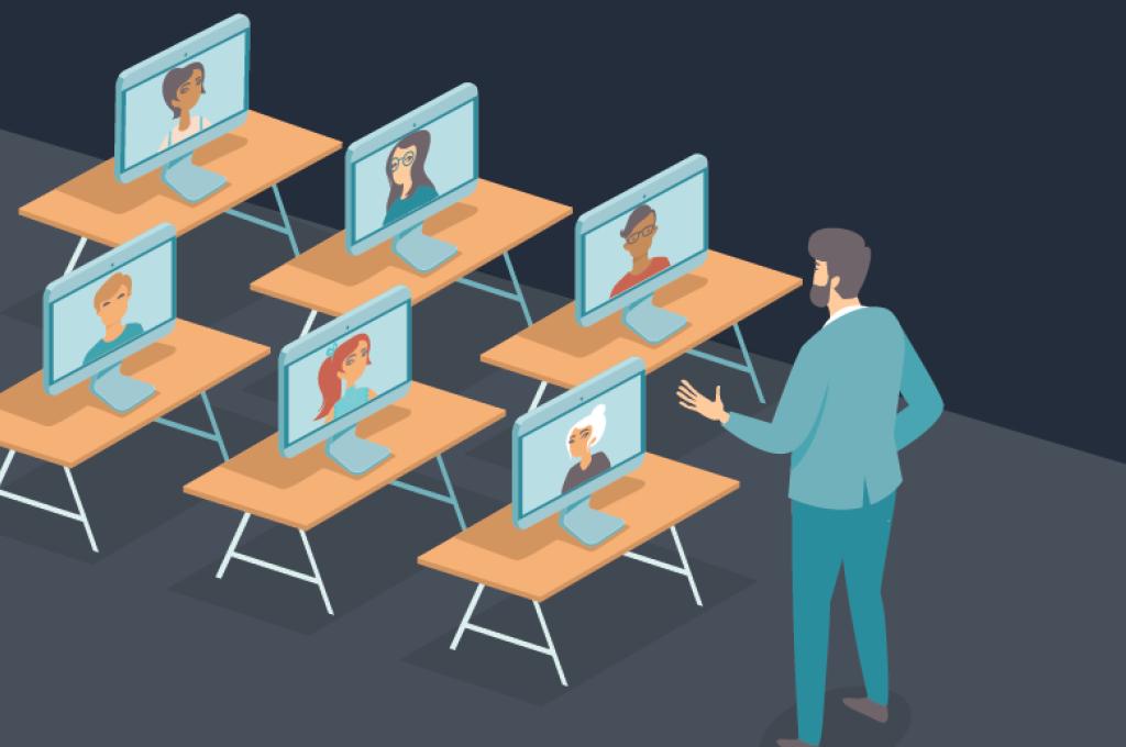 Enseignante qui parle devant plusieurs écrans installés sur des pupitres pour illustrer le concept d’apprentissage en ligne