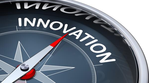 A stock photo of an illustrated compass with the arrow pointed to the word "Innovation."
