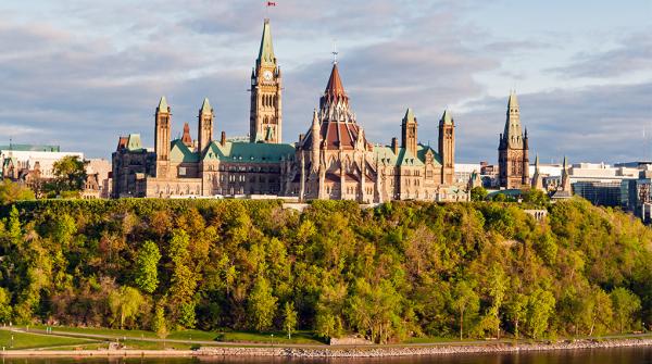 A photo of Parliament Hill taken from the Ottawa River.
